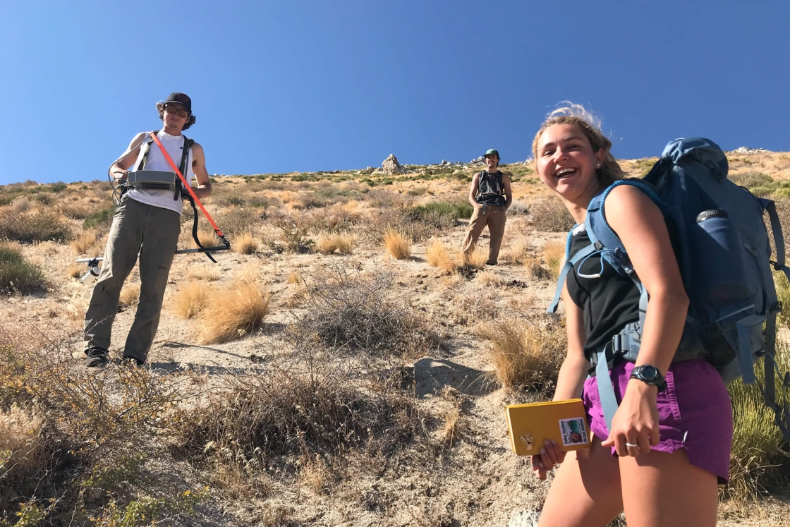 In Owens Valley, Calif., three students use a magnetometer to measure changes in the magnetic field and map the iron and magnesium-rich buried lava flow in the area.