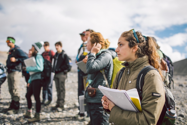 Students listen to Associate Professor Erich Osterberg explain an assignment on the Athabasca Glacier.