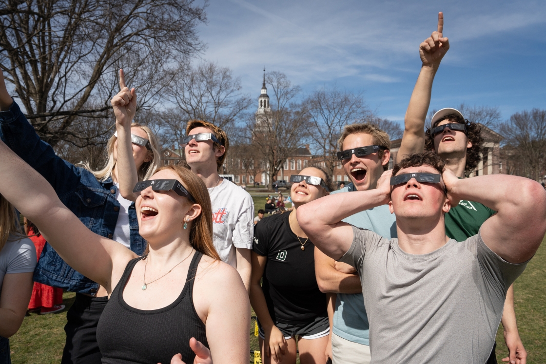 Students react to the eclipse on the Dartmouth Green