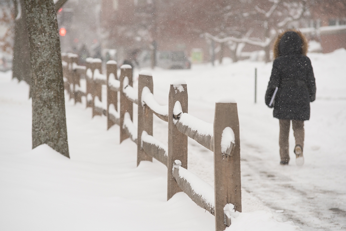Student walking on A snowy day at Dartmouth.