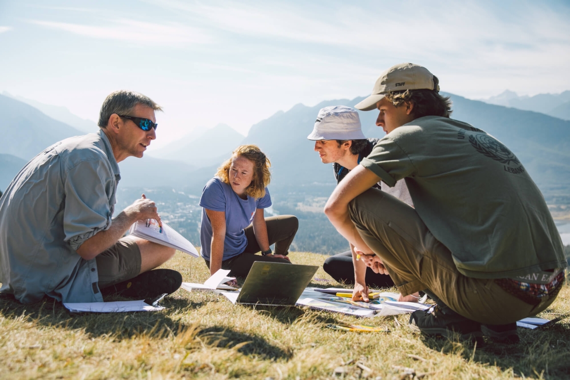 From left, Associate Professor Erich Osterberg, Berit DeGrandpre ’20, Garrett Rawlings ’20, and Connor Haines ’20 look at geological formations above the Bow Valley in Banff.