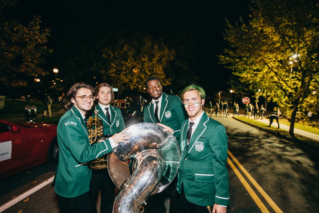 Members of the Dartmouth band pause before the parade