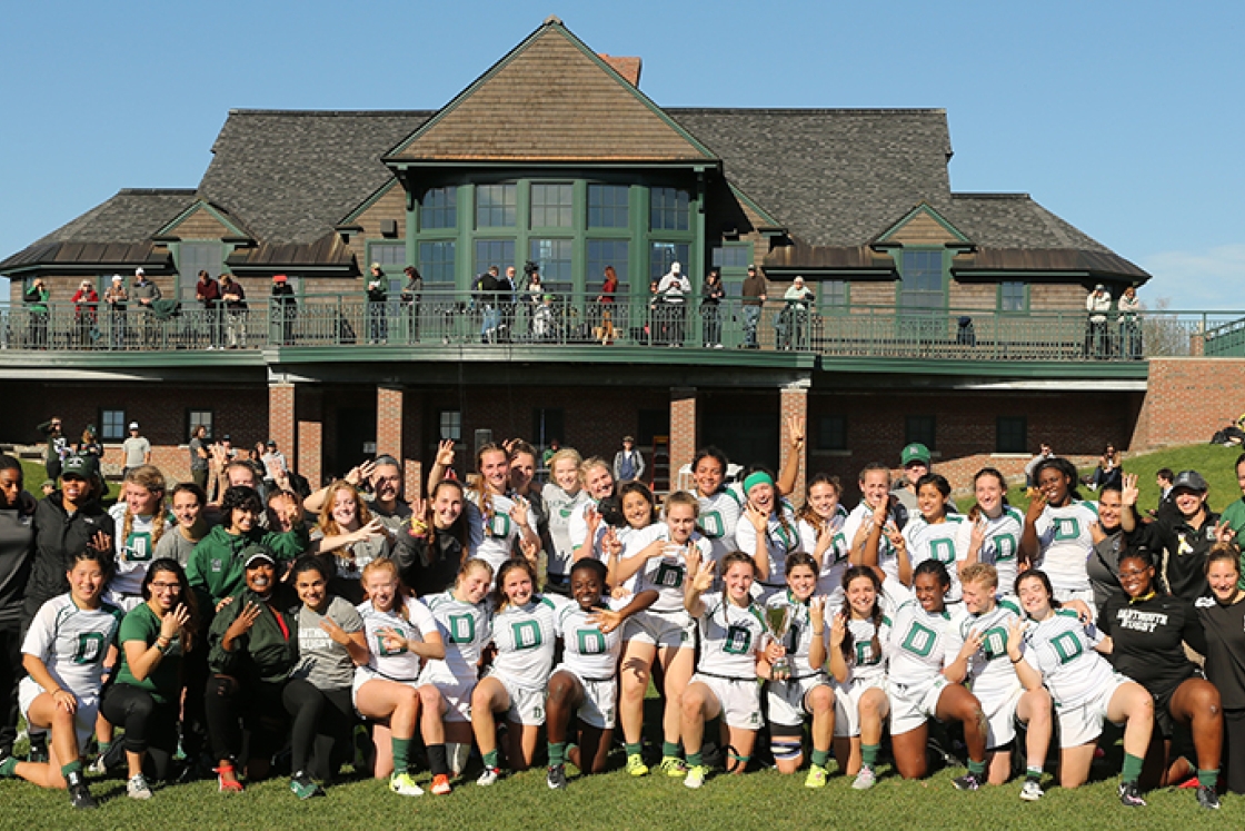 the Dartmouth women's rugby team standing together outside