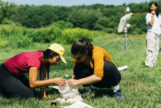 Theresa Ong and student in the field studying nature