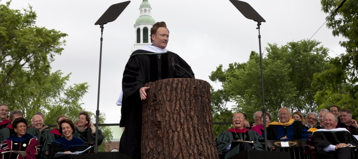 Conan O'Brien speaking at the podium at Commencement.