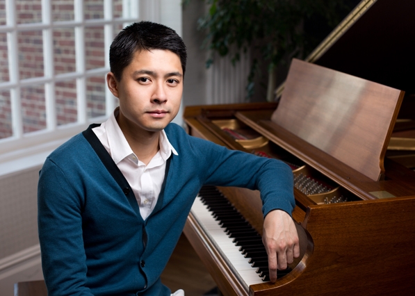 William Cheng sitting at a piano