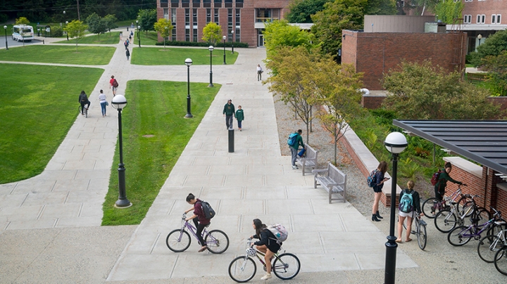students riding bikes outside the Life Sciences center