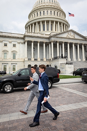 Students pass the Capitol dome