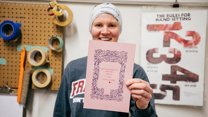 Kariann Ketcham, senior immigration adviser in Dartmouth's Office of Visa and Immigration Services, shows the card she made in the Book Arts Workshop.