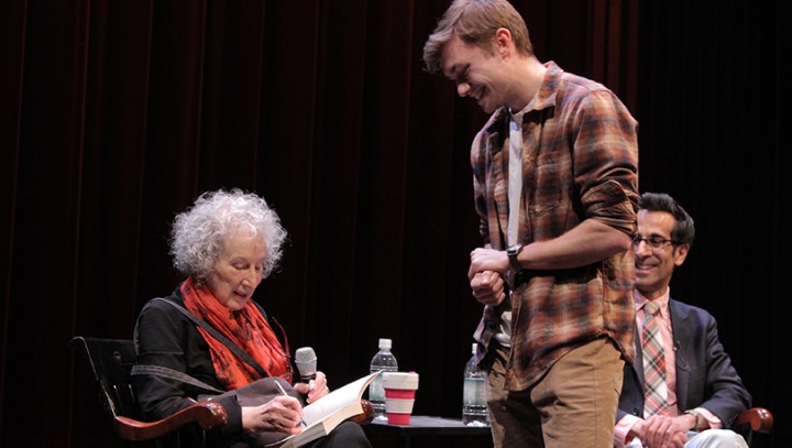 After her lecture, Margaret Atwood signs a book for Jack Jacobs ’21.