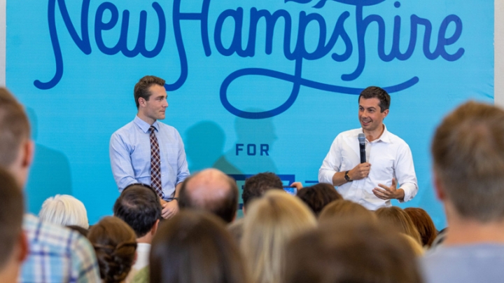 Dartmouth student and New Hampshire state Rep. Garrett Muscatel '20, left, moderated the question-and-answer period at a campaign event for South Bend, Indiana Mayor Pete Buttigieg, pictured right, at the Hanover Inn in August.